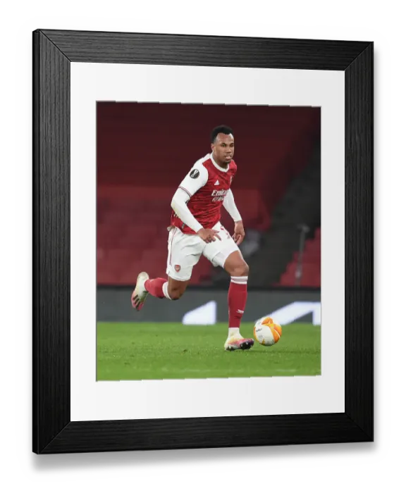 Framed Print : Arsenal's Gabriel in Europa League Action: Arsenal v Olympiacos, Emirates Stadium (Behind Closed Doors)