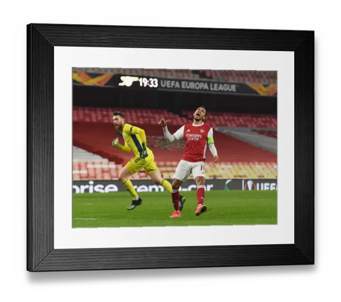 Framed Print : Arsenal's Aubameyang Displays Frustration in Empty Emirates During Europa League Match vs. Olympiacos Framed Print : Arsenal's Aubameyang Displays Frustration in Empty Emirates During Europa League Match vs. Olympiacos