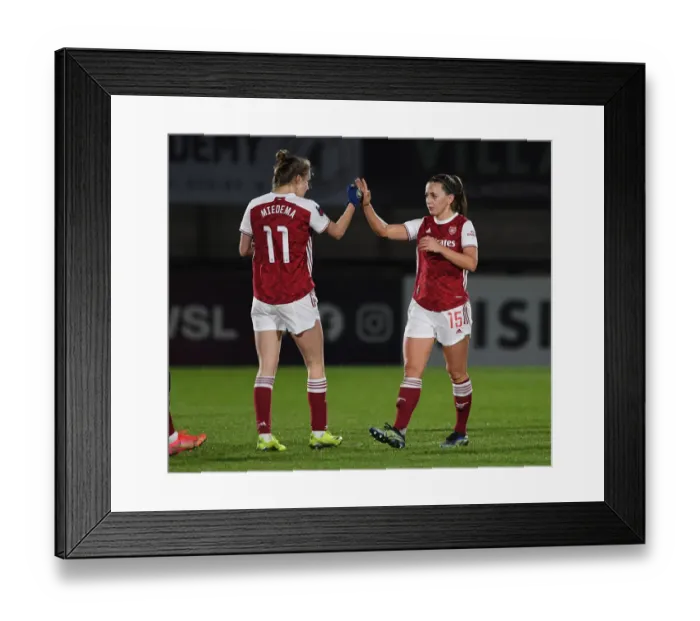 Framed Print : Arsenal Women Triumph Over Manchester United: Miedema and McCabe Celebrate FA WSL Victory Amidst Empty Stands