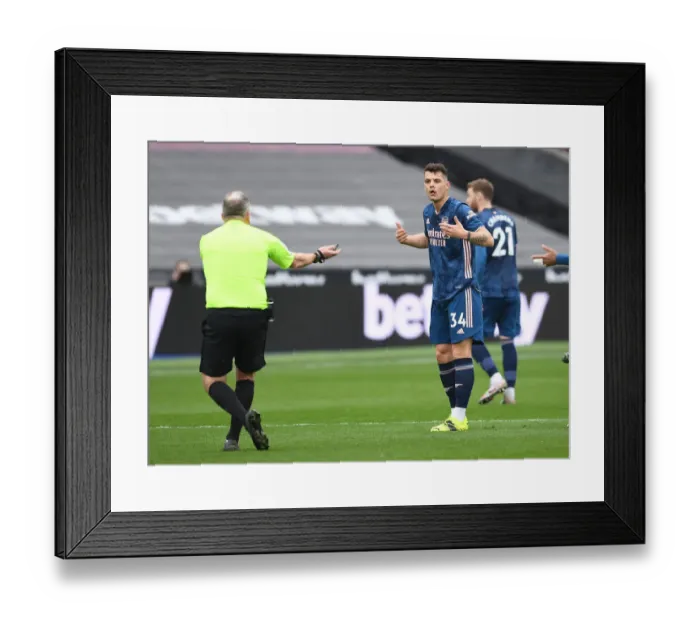 Framed Print : Xhaka's Controversial Moment: Arsenal vs. West Ham in Empty London Stadium (Premier League, March 2021)