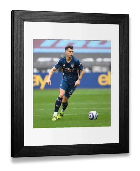 Framed Print : Granit Xhaka's Brilliant Midfield Performance: Arsenal's Empty-Arena Victory over West Ham United (2020-21) Framed Print : Granit Xhaka's Brilliant Midfield Performance: Arsenal's Empty-Arena Victory over West Ham United (2020-21)