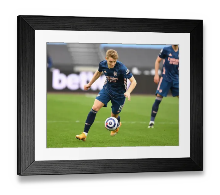 Framed Print : Behind Closed Doors: Martin Odegaard Leads Arsenal Past West Ham in Empty London Stadium