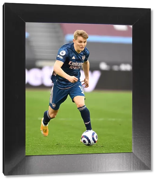 Behind Closed Doors: Martin Odegaard in Action for Arsenal vs. West Ham United (Premier League, 2021)