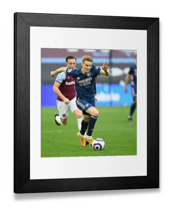 Framed Print : Martin Odegaard Scores the Thriller: Arsenal's Victory at Empty West Ham Stadium, Premier League 2020-21