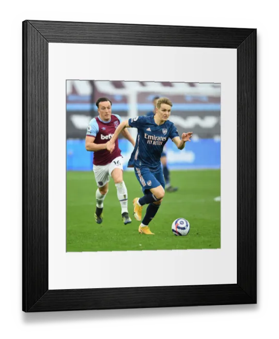 Framed Print : Behind Closed Doors: Martin Odegaard Outsmarts Noble in Arsenal's Triumph over West Ham, Premier League 2021 Framed Print : Behind Closed Doors: Martin Odegaard Outsmarts Noble in Arsenal's Triumph over West Ham, Premier League 2021