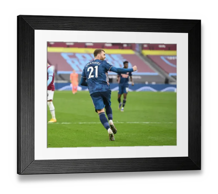 Framed Print : Calum Chambers Double Celebration: Arsenal's Victory Over West Ham United in Empty London Stadium (2020-21) Framed Print : Calum Chambers Double Celebration: Arsenal's Victory Over West Ham United in Empty London Stadium (2020-21)