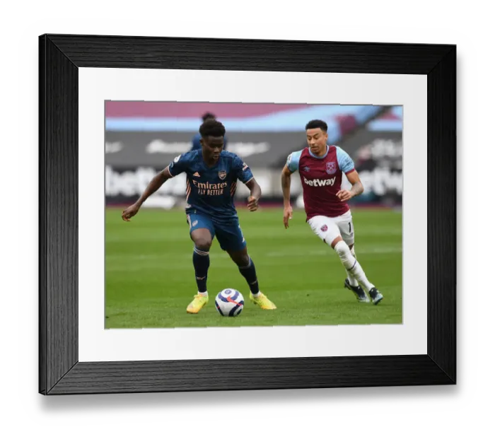 Framed Print : Bukayo Saka vs Jesse Lingard: Intense Battle at London Stadium - West Ham United vs Arsenal, Premier League 2020-21