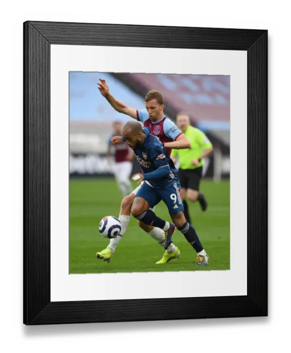 Framed Print : Arsenal's Lacazette Clashes with West Ham's Soucek in Premier League Showdown Framed Print : Arsenal's Lacazette Clashes with West Ham's Soucek in Premier League Showdown