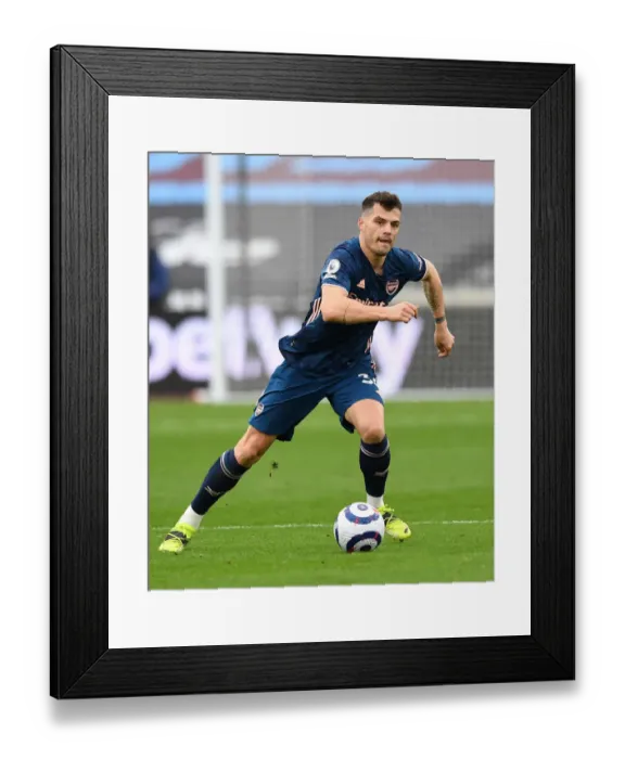 Framed Print : Granit Xhaka in Action: West Ham United vs. Arsenal, Premier League 2020-21