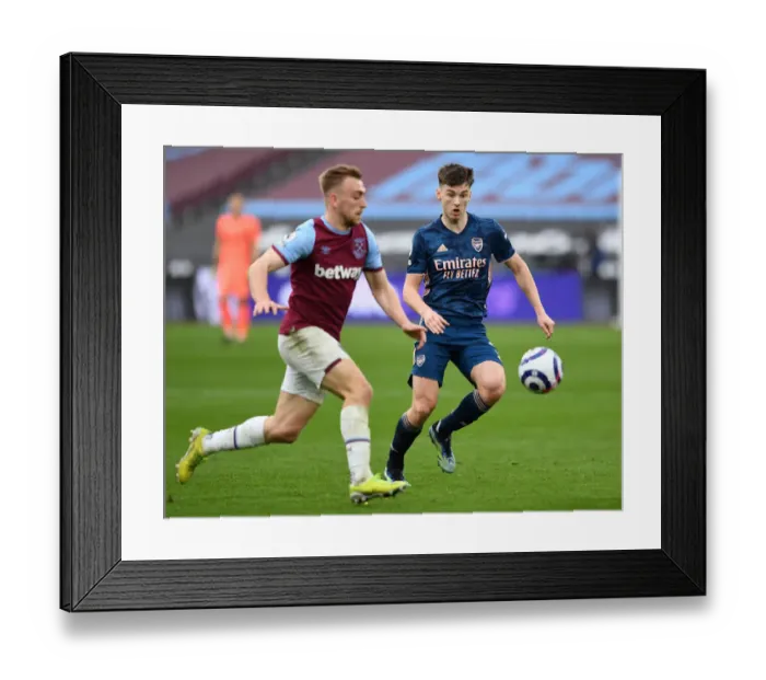 Framed Print : Arsenal's Kieran Tierney Closes In on West Ham's Jarrod Bowen in Intense Premier League Clash Framed Print : Arsenal's Kieran Tierney Closes In on West Ham's Jarrod Bowen in Intense Premier League Clash