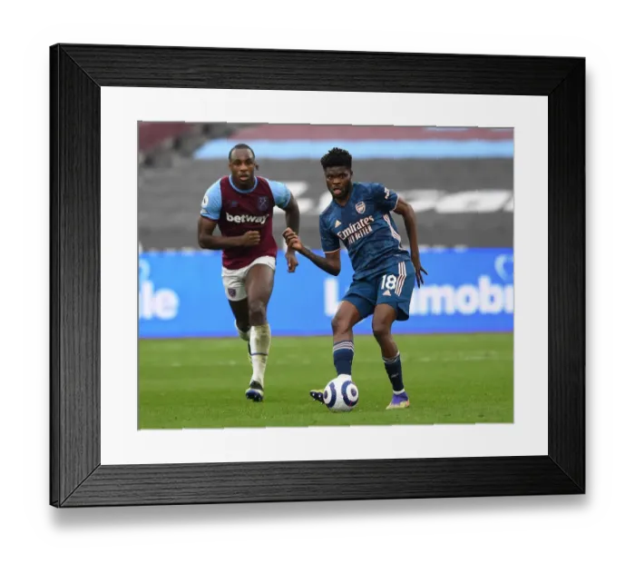 Framed Print : Thomas Partey vs Michail Antonio: Intense Battle in West Ham United vs Arsenal Premier League Clash