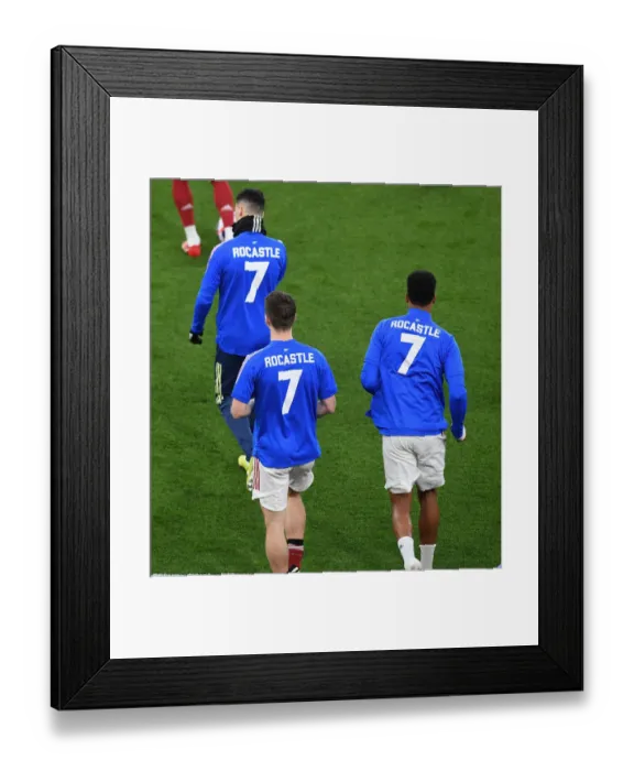 Framed Print : Arsenal Honors Late Legend Rocastle with 7 Shirts in Empty Emirates Stadium vs Liverpool (2020-21) Framed Print : Arsenal Honors Late Legend Rocastle with 7 Shirts in Empty Emirates Stadium vs Liverpool (2020-21)