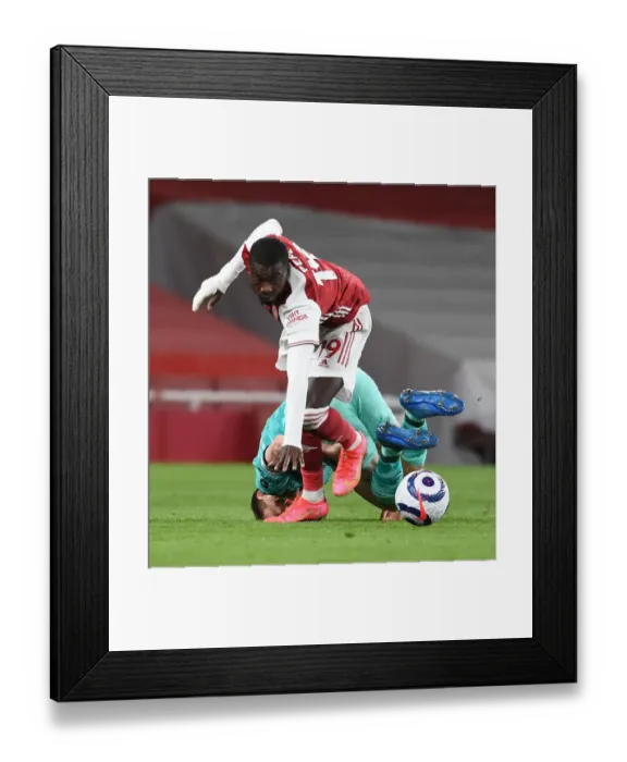 Framed Print : Empty Battle: Pepe vs. Milner - Arsenal vs. Liverpool Amidst Coronavirus Restrictions