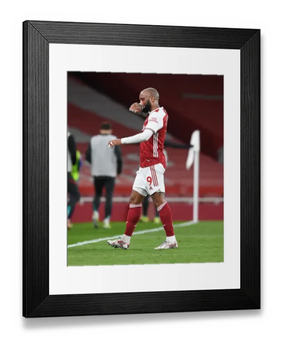 Framed Print : Arsenal's Alexis Lacazette Suffers Injury in Empty Emirates Stadium During Arsenal v Liverpool Premier League Clash (2020-21)