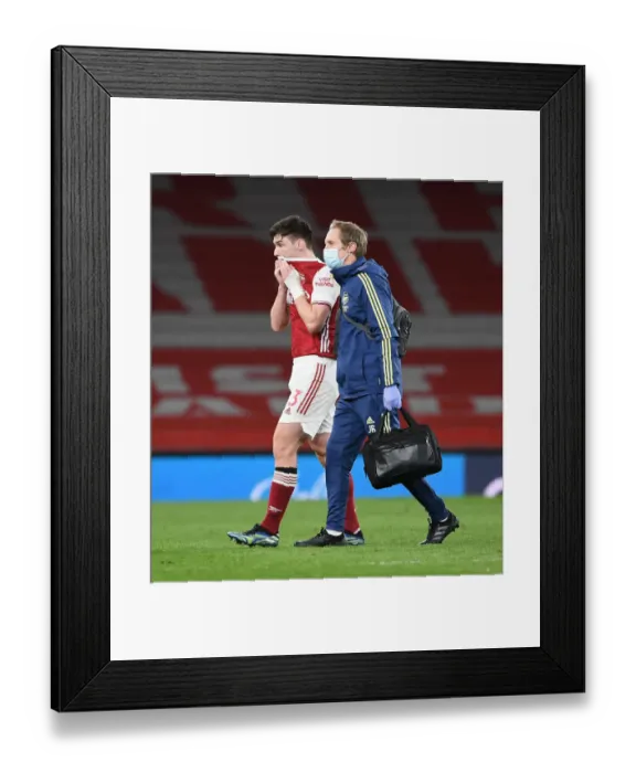 Framed Print : Arsenal's Kieran Tierney Suffers Injury and Exits Field During Arsenal vs Liverpool (2021)