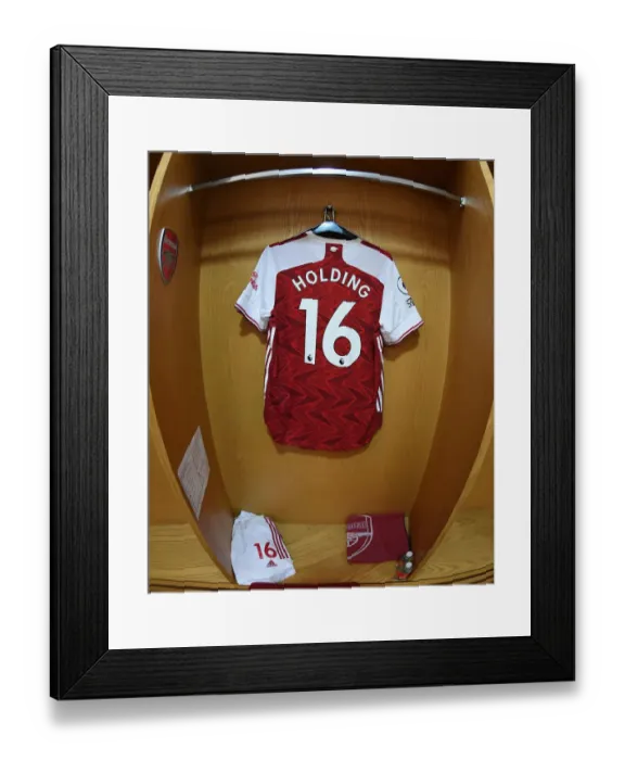 Framed Print : Empty Arsenal: Rob Holding's Ghostly Shirt in Deserted Emirates Stadium (Arsenal v Liverpool, 2021)