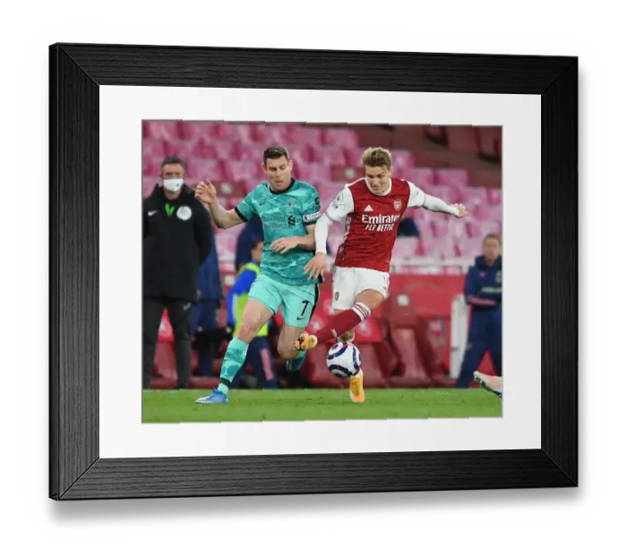 Framed Print : Odegaard vs. Milner: A Premier League Battle at Emirates Stadium Framed Print : Odegaard vs. Milner: A Premier League Battle at Emirates Stadium