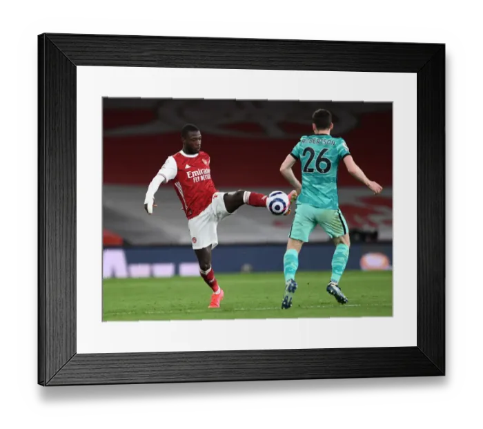 Framed Print : Arsenal vs. Liverpool: Pepe vs. Robertson - Intense Battle in the Premier League