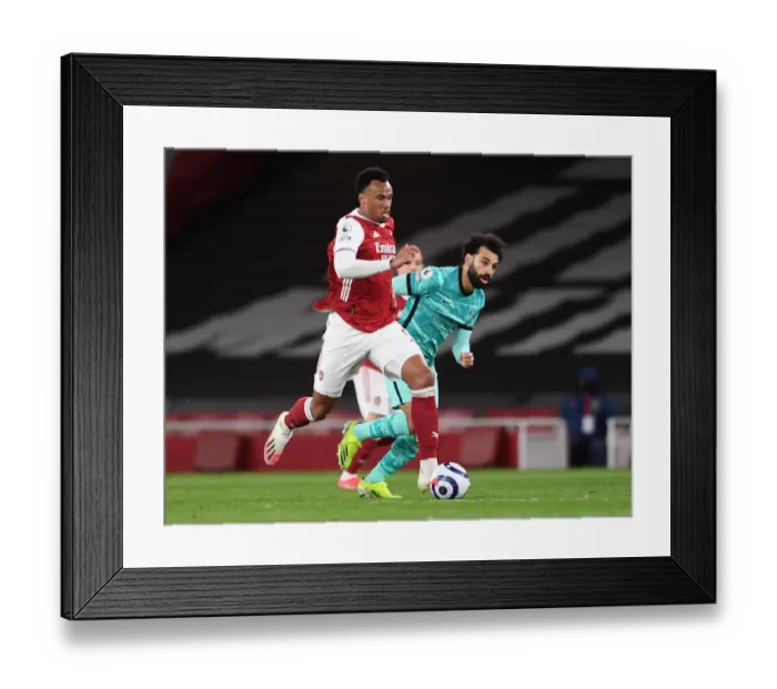 Framed Print : Arsenal vs. Liverpool: Gabriel Magalhaes vs. Mohamed Salah - Premier League Showdown at Emirates Stadium