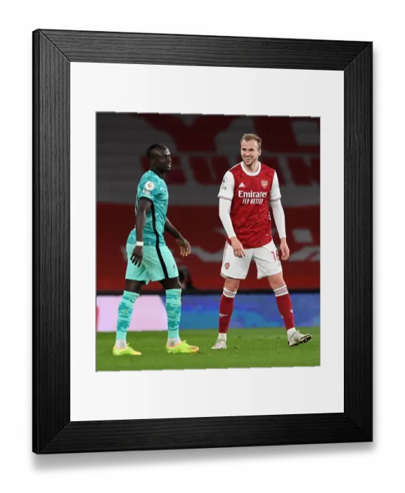 Framed Print : Arsenal vs. Liverpool: A Light-Hearted Moment Amidst Premier League Rivalry Framed Print : Arsenal vs. Liverpool: A Light-Hearted Moment Amidst Premier League Rivalry