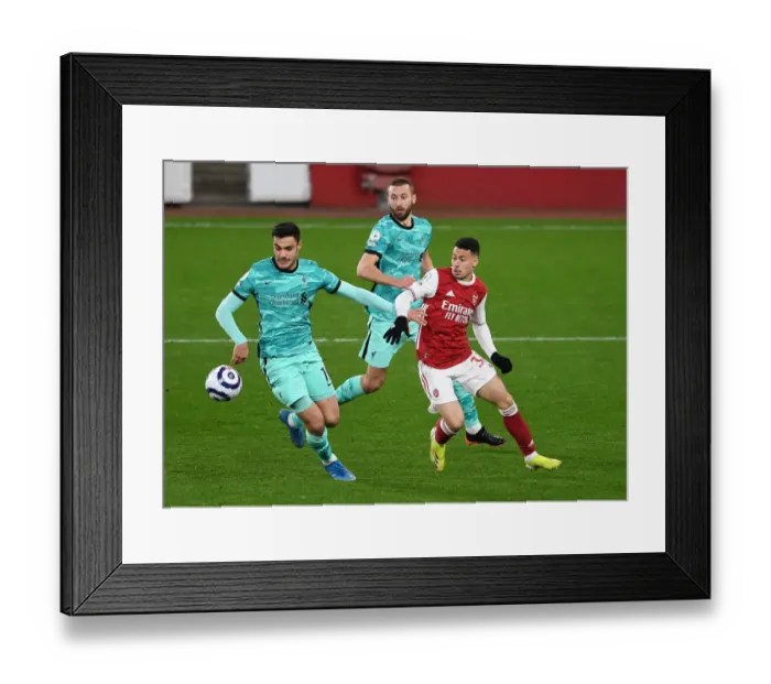 Framed Print : Arsenal vs. Liverpool: Intense Battle for the Ball Framed Print : Arsenal vs. Liverpool: Intense Battle for the Ball