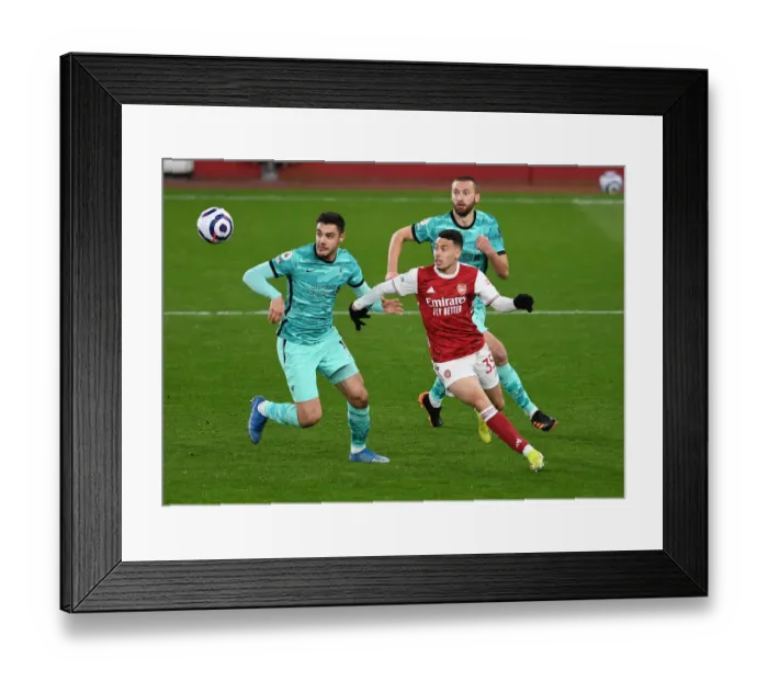 Framed Print : Arsenal vs. Liverpool: A Battle for Every Inch - Martinelli's Determined Tussle