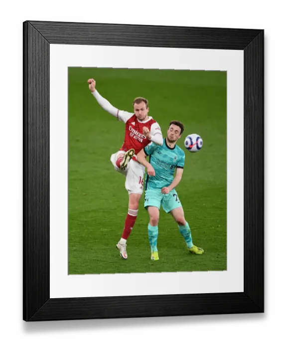 Framed Print : Holding His Ground: Rob's Pressure-Clearing Moment in Arsenal vs. Liverpool's Premier League Battle