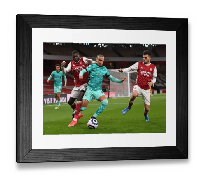 Framed Print : Arsenal vs. Liverpool: Pepe and Ceballos Clash in Intense Premier League Showdown
