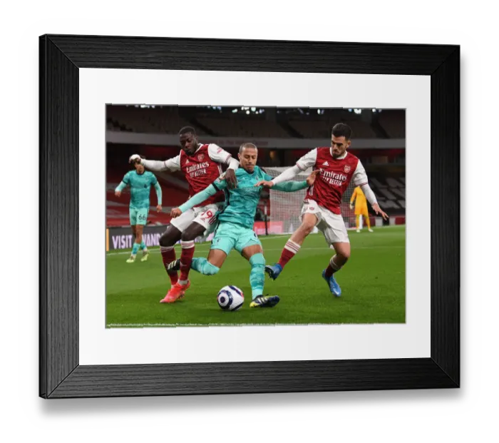 Framed Print : Arsenal's Pepe and Ceballos Clash with Liverpool's Thiago: Intense Rivalry on the Emirates Field