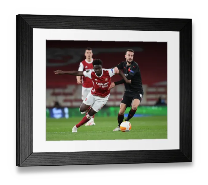 Framed Print : Empty Emirates: Bukayo Saka Leads Arsenal Against Slavia Praha in Europa League Quarterfinal
