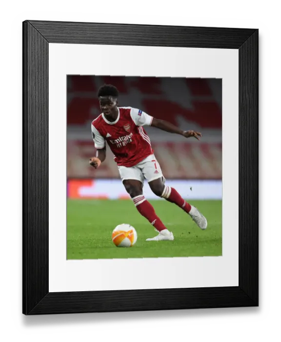 Framed Print : Arsenal's Bukayo Saka at Empty Emirates Stadium: Arsenal vs Slavia Praha, UEFA Europa League Quarterfinal (2021)