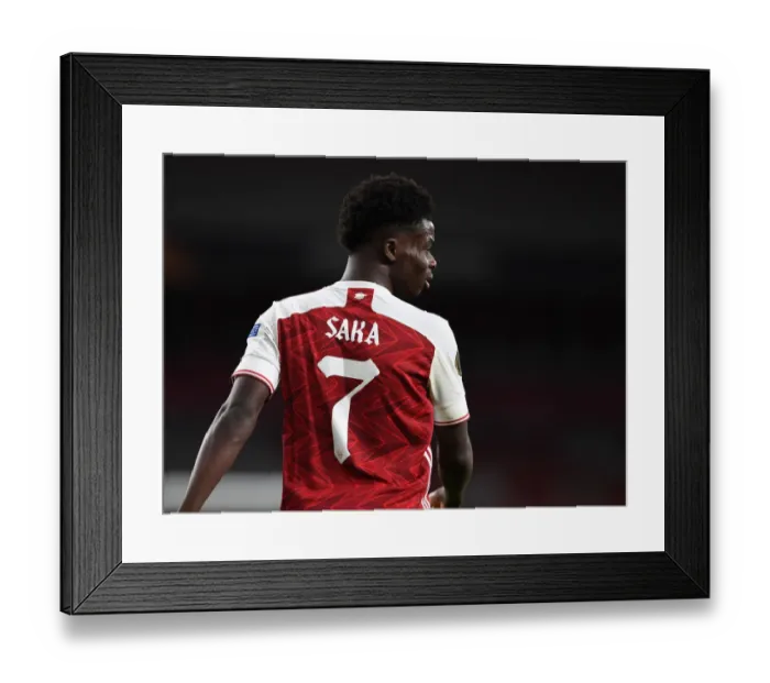 Framed Print : Lone Warrior: Bukayo Saka's Europa League Battle at Empty Emirates