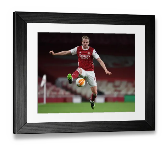 Framed Print : Behind Closed Doors: Rob Holding Faces Slavia Praha in Europa League Quarterfinal for Arsenal Framed Print : Behind Closed Doors: Rob Holding Faces Slavia Praha in Europa League Quarterfinal for Arsenal