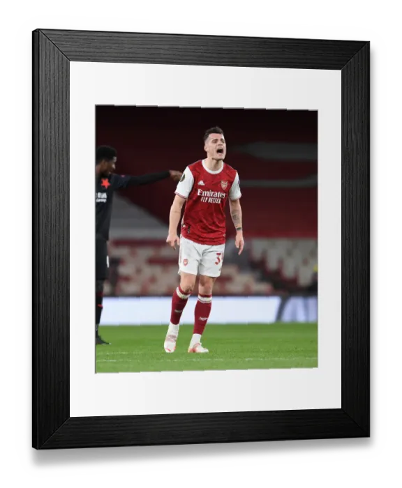 Framed Print : Granit Xhaka at Empty Emirates: Arsenal vs Slavia Praha in UEFA Europa League Quarterfinal Framed Print : Granit Xhaka at Empty Emirates: Arsenal vs Slavia Praha in UEFA Europa League Quarterfinal