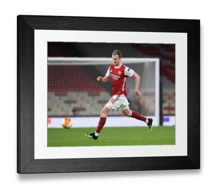 Framed Print : Arsenal's Rob Holding in Action at Emptied Emirates: Arsenal vs Slavia Praha, Europa League Quarterfinal (2021) Framed Print : Arsenal's Rob Holding in Action at Emptied Emirates: Arsenal vs Slavia Praha, Europa League Quarterfinal (2021)