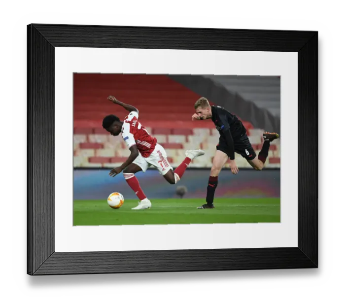 Framed Print : Arsenal's Bukayo Saka Tripped by Slavia Praha's David Zima in Empty Europa League Quarterfinal (2020-21)