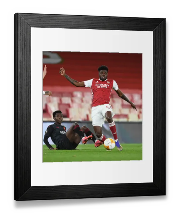 Framed Print : Arsenal's Thomas Partey Overpowers Slavia Praha in Empty Europa League Quarterfinal Framed Print : Arsenal's Thomas Partey Overpowers Slavia Praha in Empty Europa League Quarterfinal