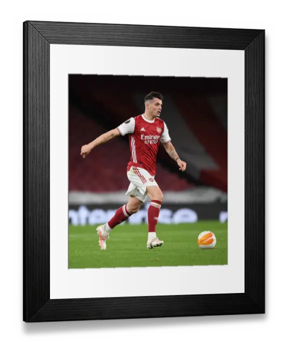 Framed Print : Arsenal FC vs Slavia Praha: Granit Xhaka in UEFA Europa League Quarterfinal at Emptied Emirates Stadium