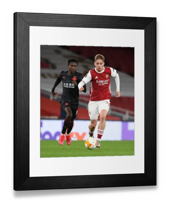Framed Print : Arsenal's Emile Smith Rowe Breaks Past Slavia Praha's Oscar Dorley in UEFA Europa League Quarterfinal at Emirates Stadium Framed Print : Arsenal's Emile Smith Rowe Breaks Past Slavia Praha's Oscar Dorley in UEFA Europa League Quarterfinal at Emirates Stadium