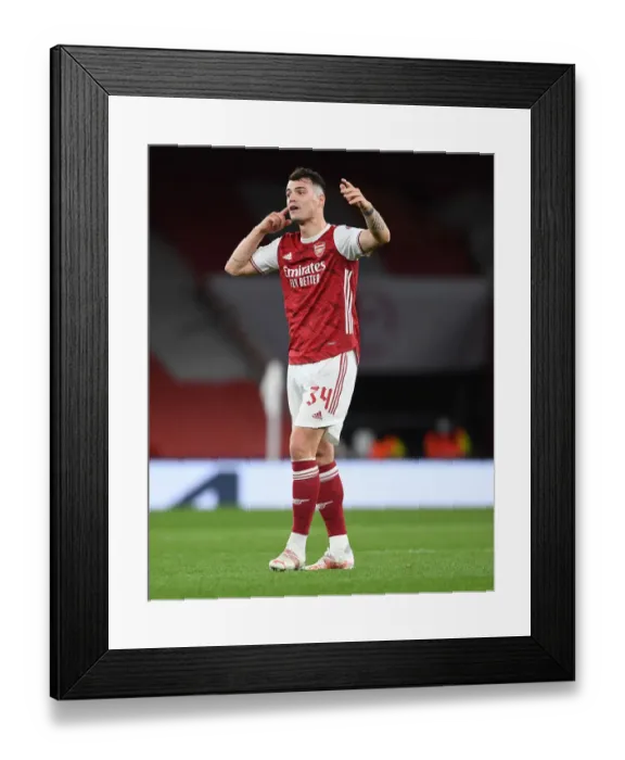 Framed Print : Lone Warrior Xhaka: Arsenal's Battle in Empty Emirates Stadium - UEFA Europa League Quarterfinal vs Slavia Praha Framed Print : Lone Warrior Xhaka: Arsenal's Battle in Empty Emirates Stadium - UEFA Europa League Quarterfinal vs Slavia Praha
