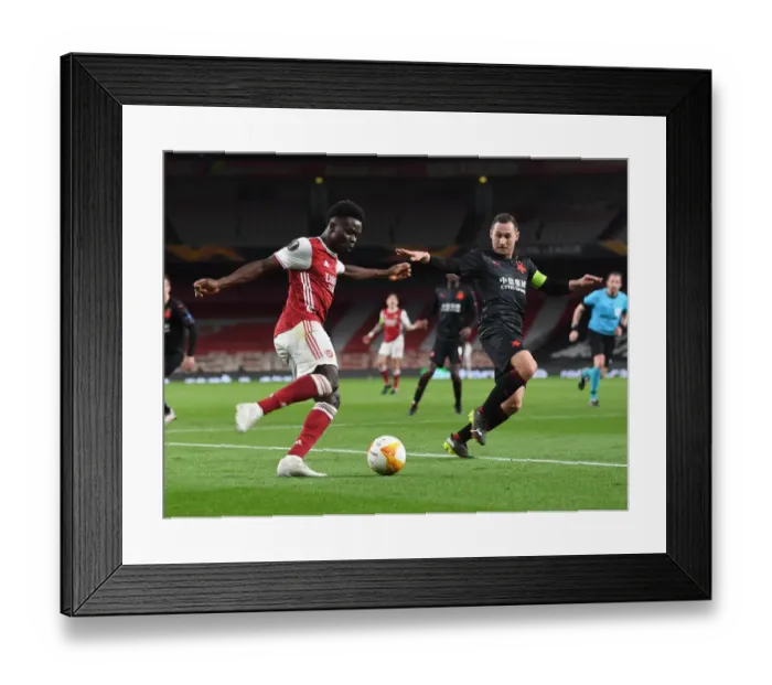 Framed Print : Arsenal's Bukayo Saka in Empty Europa League Quarterfinal: Arsenal vs Slavia Prague (2021)
