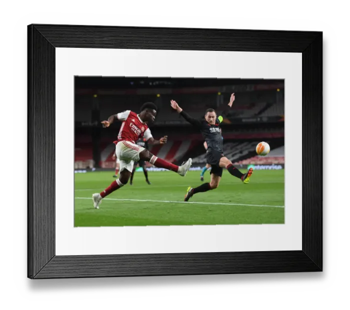 Framed Print : Bukayo Saka in Empty Emirates: Arsenal's Lone Warrior in Europa League Quarterfinal vs Slavia Praha