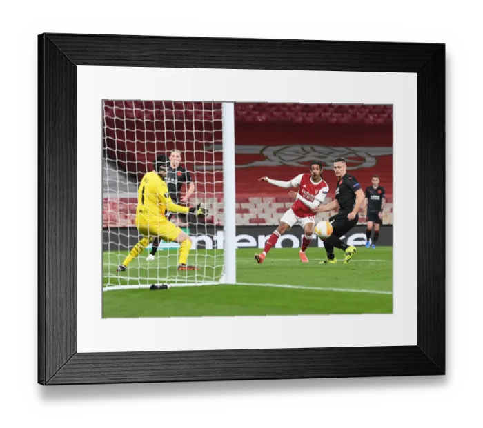 Framed Print : Arsenal's Aubameyang Scores Alone in Empty Emirates Stadium - Arsenal FC vs Slavia Praha, UEFA Europa League Quarterfinal (2021)