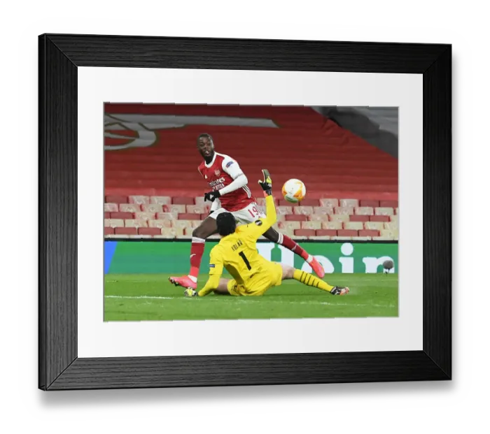 Framed Print : Nicolas Pepe's Spectacular Chip: Arsenal's Winning Goal in Empty Europa League Quarterfinal Against Slavia Praha Framed Print : Nicolas Pepe's Spectacular Chip: Arsenal's Winning Goal in Empty Europa League Quarterfinal Against Slavia Praha