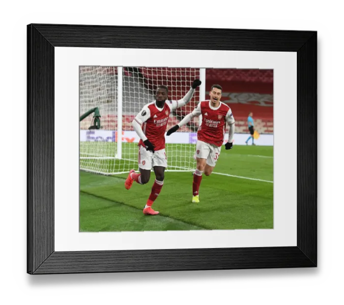 Framed Print : Arsenal's Nicolas Pepe and Gabriel Martinelli Celebrate Goal in Empty Emirates Stadium During Europa League Quarterfinal vs Slavia Praha