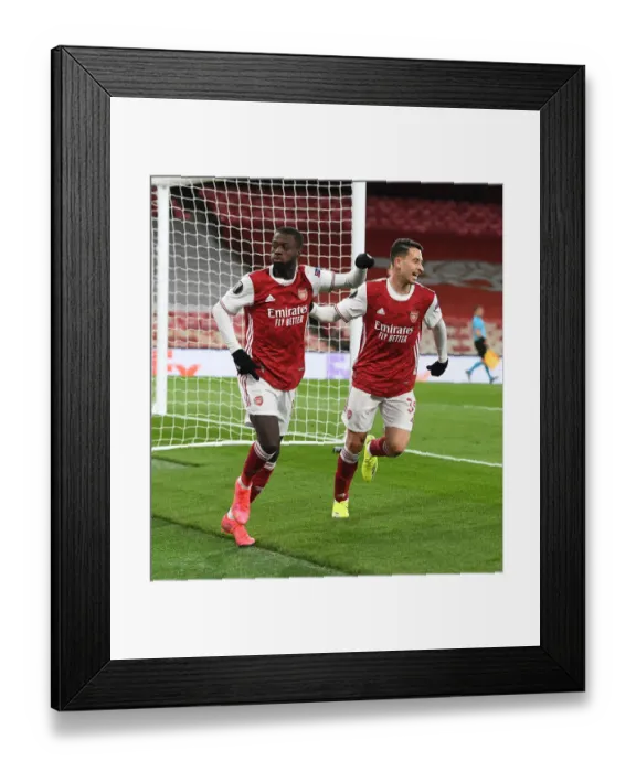 Framed Print : Arsenal's Pepe and Martinelli Celebrate Goal in Empty Emirates Stadium - UEFA Europa League Quarterfinal Framed Print : Arsenal's Pepe and Martinelli Celebrate Goal in Empty Emirates Stadium - UEFA Europa League Quarterfinal