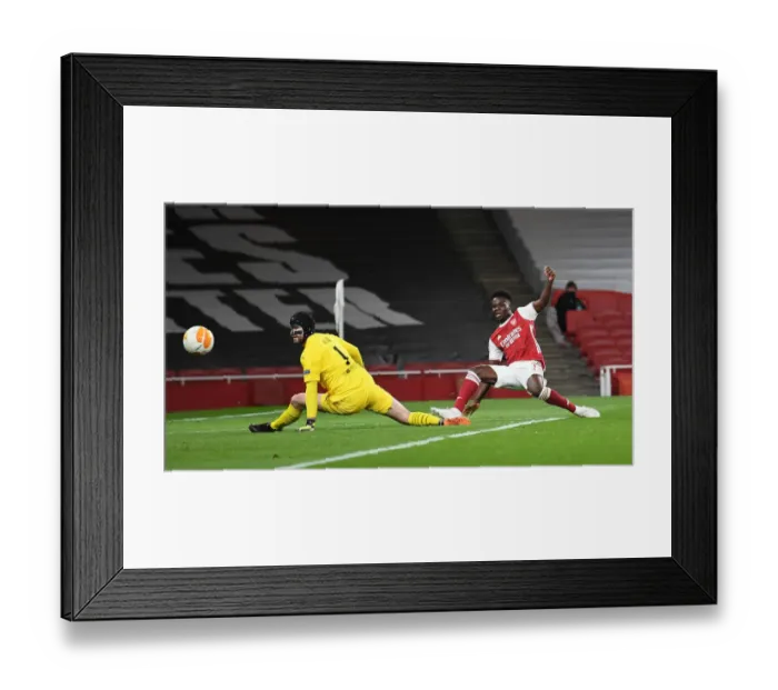 Framed Print : Bukayo Saka Scores in Empty Arsenal Stadium: Arsenal vs. Slavia Praha in Europa League Quarterfinals