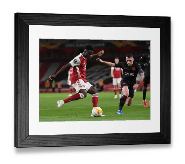 Framed Print : Arsenal vs Slavia Prague: Bukayo Saka Tackled in UEFA Europa League Quarterfinal at Empty Emirates Stadium Framed Print : Arsenal vs Slavia Prague: Bukayo Saka Tackled in UEFA Europa League Quarterfinal at Empty Emirates Stadium
