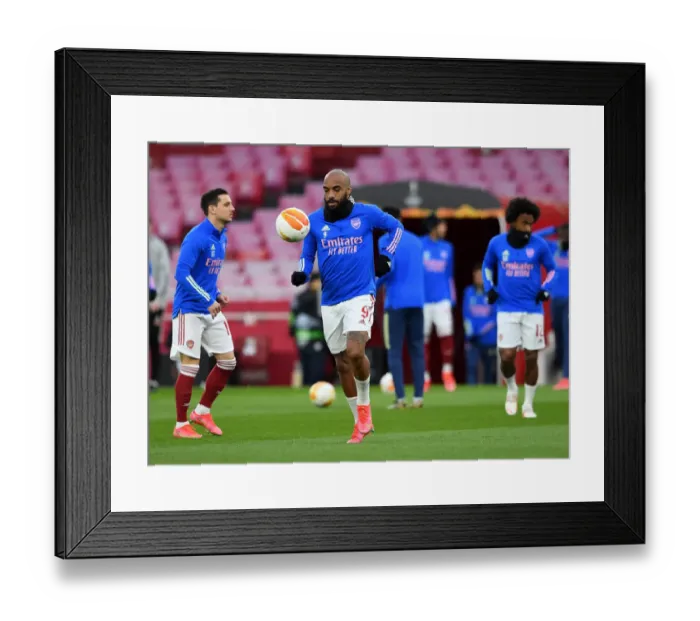 Framed Print : Arsenal FC vs Slavia Praha: Alexandre Lacazette Prepares for Europa League Quarterfinal at Empty Emirates Stadium
