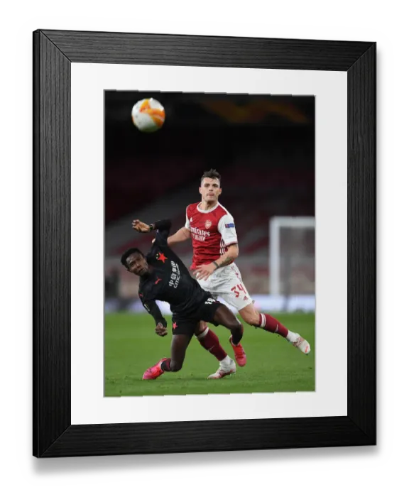 Framed Print : Arsenal vs Slavia Prague: Granit Xhaka Clashes in Empty Europa League Quarterfinal